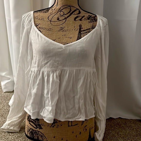 This is an Oneill sheer long sleeve top. - Picture 1 of 4